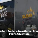 Custom trailer towing through scenic landscape for adventure trips”