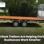 Flat deck trailer transporting construction materials for a Christchurch business.