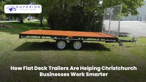 Flat deck trailer transporting construction materials for a Christchurch business.